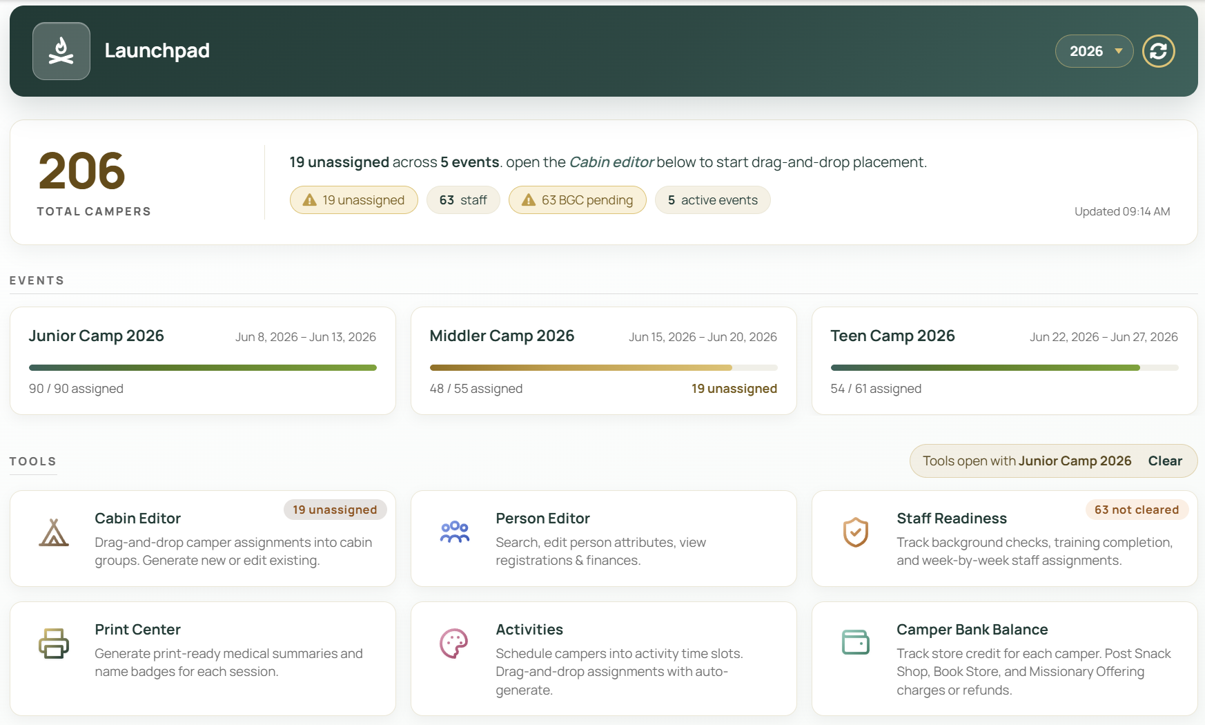 CampOS Launchpad showing 206 campers, Junior, Middler, and Teen Camp 2026 with cabin assignment progress, and tools for Cabin Editor, Staff Readiness, Print Center, Activities, and Camper Bank Balance